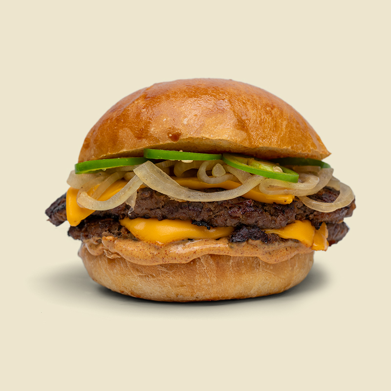 Artisan burger bun, 4 oz 100% chuck roast partty, american cheese, caramelized onions, jalapeño peppers and house special sauce.